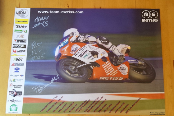 The Metiss poster, signed by the riders.